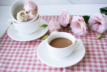 coffee with milk and beautiful roses