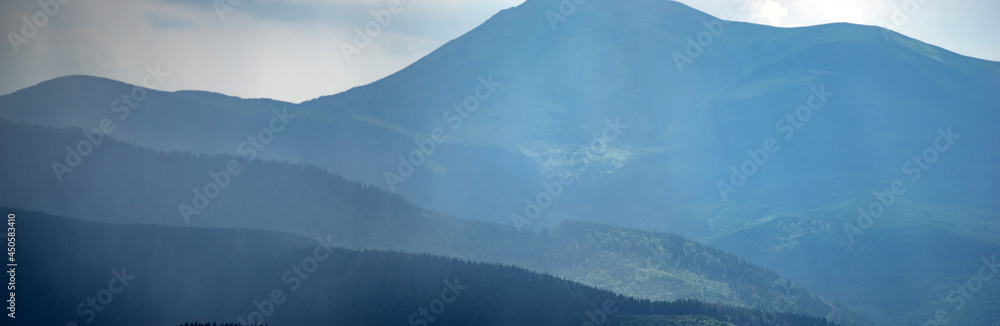 Wall mural sun rays and rain in the carpathian mountains in summer