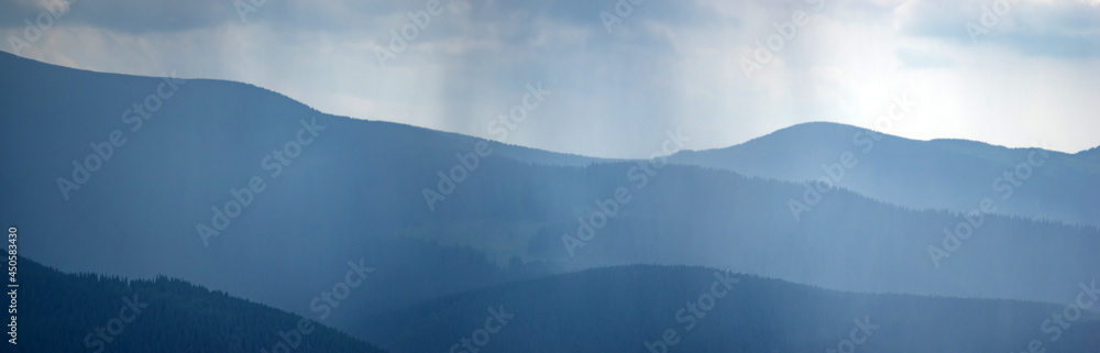 Wall mural sun rays and rain in the carpathian mountains in summer