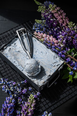 Ice cream in vintage can.  Fresh frozen dessert. Summer joy. Violet syrup, blueberry lavender flavor. Metal tray selective focus. 