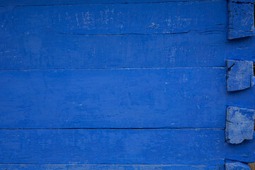 Blue wooden background with copy space. Wall of an old cottage. 