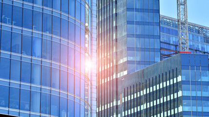 Fototapeta na wymiar High-rise building under construction. Modern office building. Sunrise.