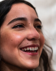 Close-up portrait of a young woman laughing