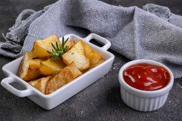 bowl of rustic fried and roasted potatoes with rosemary