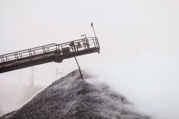 Hot briquetted iron are piled from the conveyor belt into a heap. Falling of lumps ore concentrate....