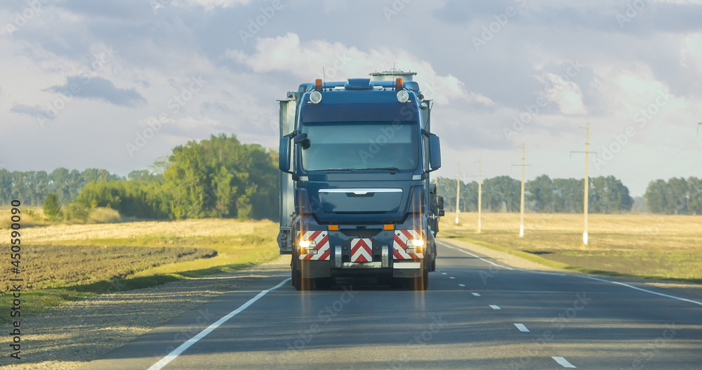 Canvas Prints Truck is moving along a country road.