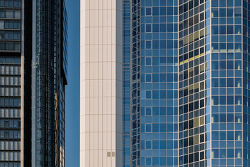 Obraz premium Exterior architectural detail modern facade of High-rise office buildings. Abstract Urban metropolis background.