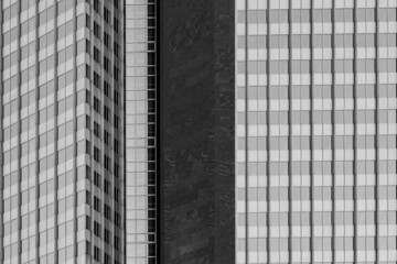 Black and white tone, Exterior architectural detail modern facade of High-rise office buildings. Abstract Urban metropolis background.