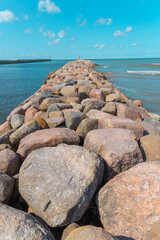 Fototapeta na wymiar Port pier made of big granite rock 