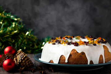 Christmas cake with fondant and candied fruit.
