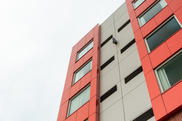 The exterior surface of an aluminum metal composite panel wall of a contemporary business...