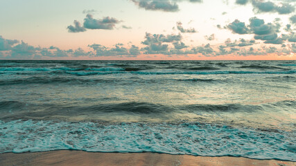 wind breeze in the beach with sea waves in evening