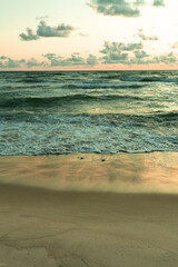 Fototapeta na wymiar wind breeze in the beach with sea waves in evening