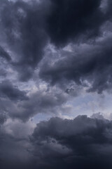 Naklejka na ściany i meble Epic Dramatic Storm sky with dark grey and black cumulus rainy clouds background texture, thunderstorm