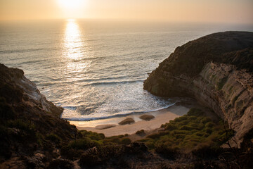 A green cliff in front of the sea, during a beautiful sunset in Quirilluca beach