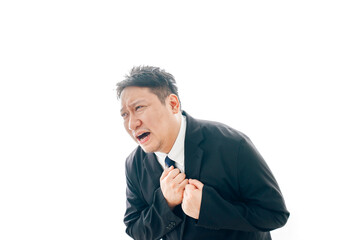 胸の痛みに苦しむスーツを着た中年男性