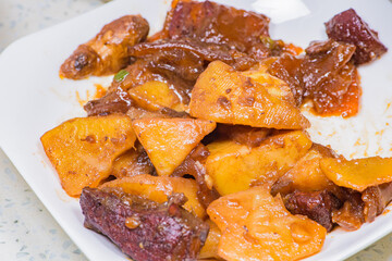 Chinese traditional food: a plate of fried chicken with potatoes