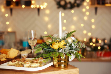 Enjoying a romantic candlelight dinner together. Candlelight dinner table setup for couple with beautiful light as background. Cozy evening for valentine's day or Christmas celebration concept