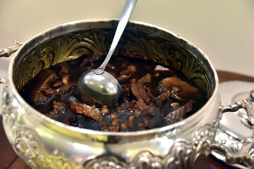 delicious meat cooked in wood sauce