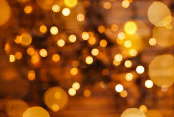 Twinkle lights bokeh. Blurred Christmas lights. Holidays. Defocused gold lights. Abstract holiday background. Beautiful shiny Christmas sparkles. Glowing magic bokeh. Defocused lights background.