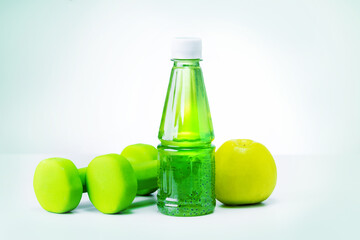 Dumbells, healthy food on light grey background.
