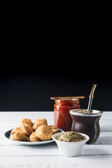 Mate, cookies and jam, over a white table. Latin Beverage. Copy space