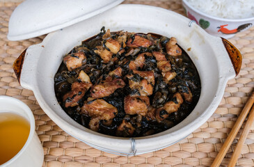 Delicious homemade meal. Stew Mui Choy aka Preserved Vegetable with Pork Belly. A popular dish made famous by the Hakka people, the pork belly;s fat melts in your mouth, eaten with rice or porridge.