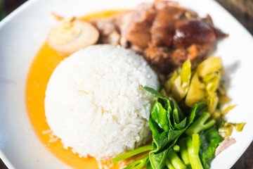 Roasted pork knuckle served on jasmine rice.