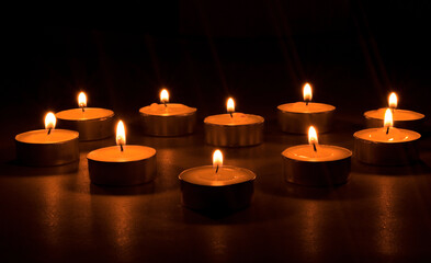 A heart-shaped candle in the dark