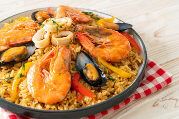Seafood Paella with prawns, clams, mussels on saffron rice