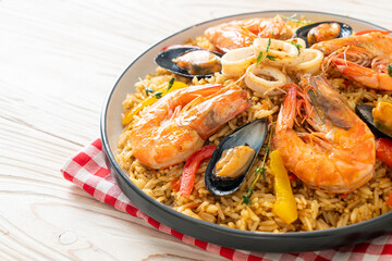 Seafood Paella with prawns, clams, mussels on saffron rice