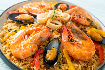 Seafood Paella with prawns, clams, mussels on saffron rice