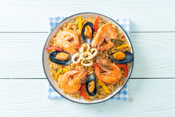 Seafood Paella with prawns, clams, mussels on saffron rice