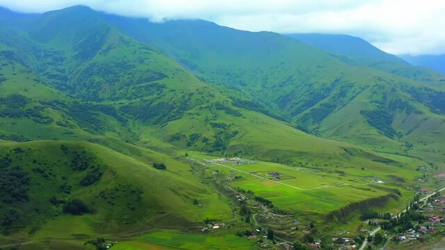 Aerial view A huge villa, a private cottage in a mountain valley near the village of Dargavs in the North Caucasus. Big House in the mountains