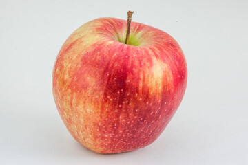 Red apple on a light gray background. Organic fruit, healthy eating, diet, lifestyle concept, treatment choice concept. Non - GMO. High-quality photo