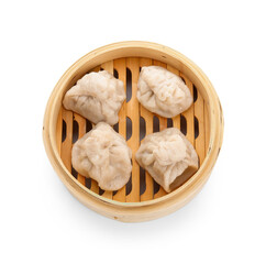 Bamboo steamer with tasty dumplings on white background