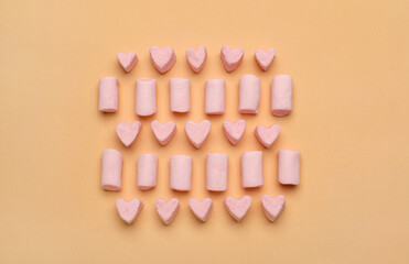 Delicious sweet marshmallows on color background