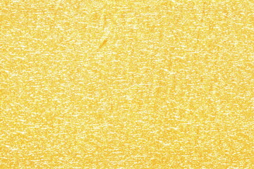 The texture of a soft knitted cotton fabric is yellow with speckles. Abstract background of soft fabric. Light background.