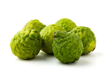 Group of bergamot isolated on white background, There are many names such as Kaffir lime, Leech lime and Mauritius papeda. it's green, rough, sour and aroma. Herbs for cooking and medicine.