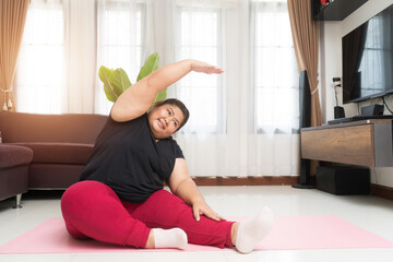 Fototapeta na wymiar Fat woman asian exercising at home, Sport and recreation idea concept.