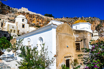 View on Monemvasia street panorama with old houses, trees in ancient town, Peloponnese, Greece