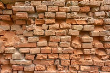 Texture of an old crumbling brick wall.