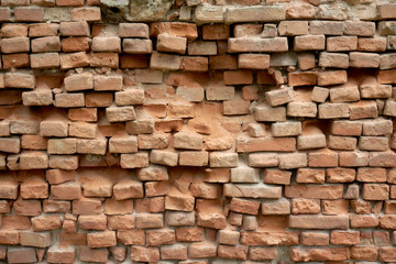 Texture of an old crumbling brick wall.