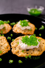 Molecular gastronomy: Keto Parmesan chips with sour cream and parsley caviar