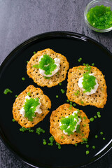 Molecular gastronomy: Keto Parmesan chips with sour cream and parsley caviar