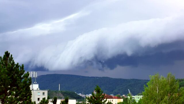 A massive Shelf cloud, Arcus cloud, is slowly moving over the city Usti nad Labem