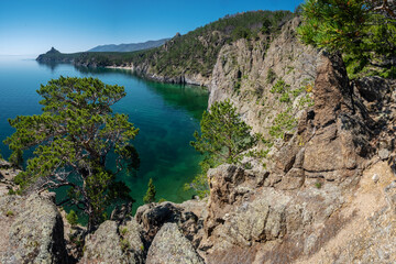 View of the rocky coast of Lake Baikal and Cape Bolshaya Kolokolnya