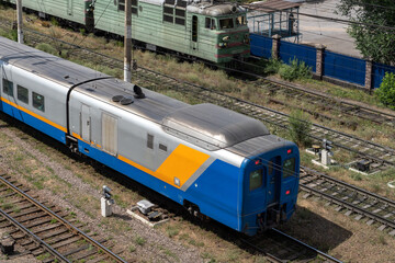 The old and the new train are nearby. Kazakhstan railway.
