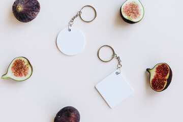 Keychain mockup to display design. Blank round and rhombus white sublimation key chain photo.