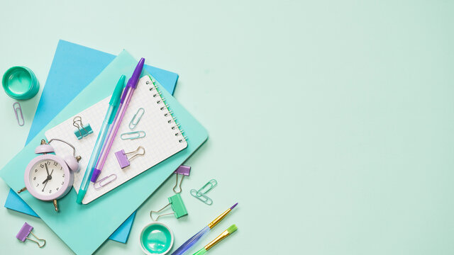 Different stationery in one color scheme on a blue background